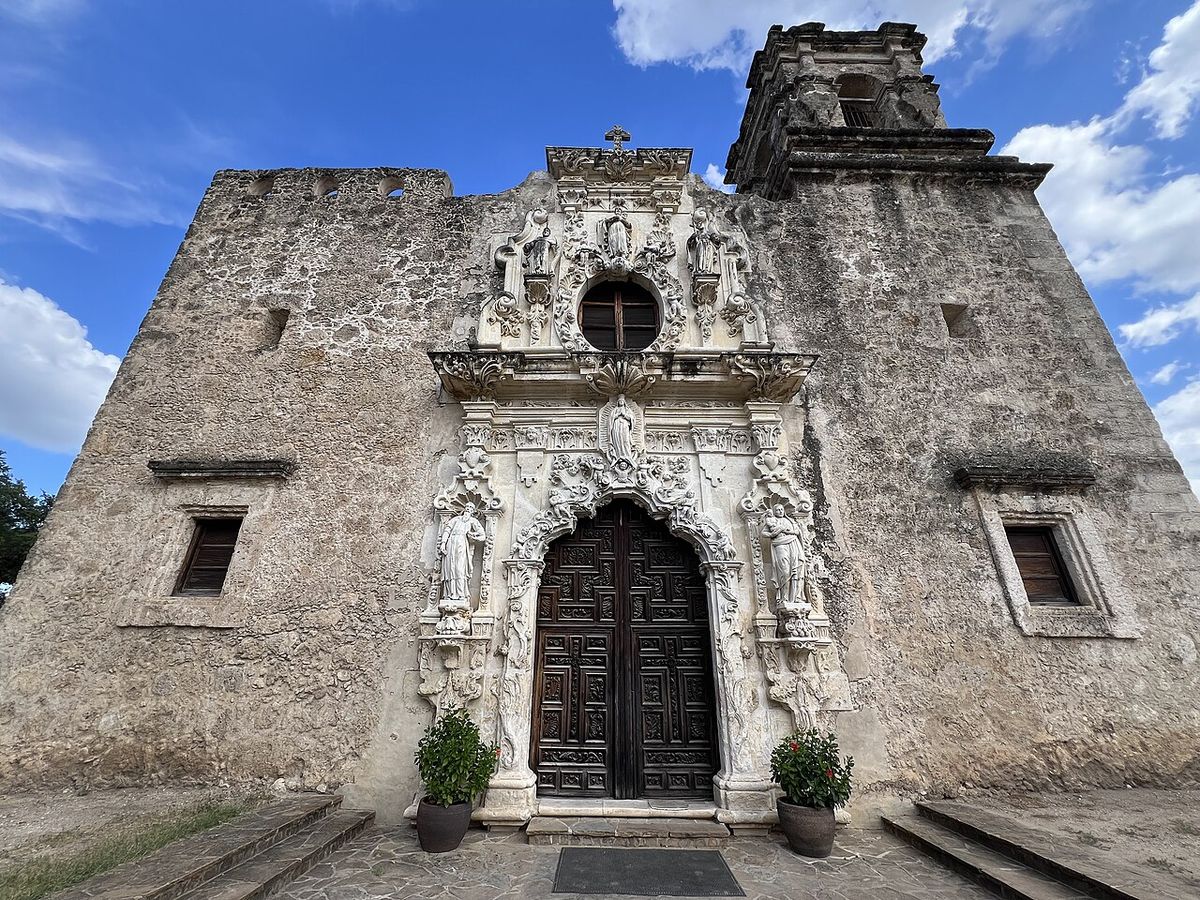 The carved stone main entrance of Mission San Jos&eacute; in San Antonio